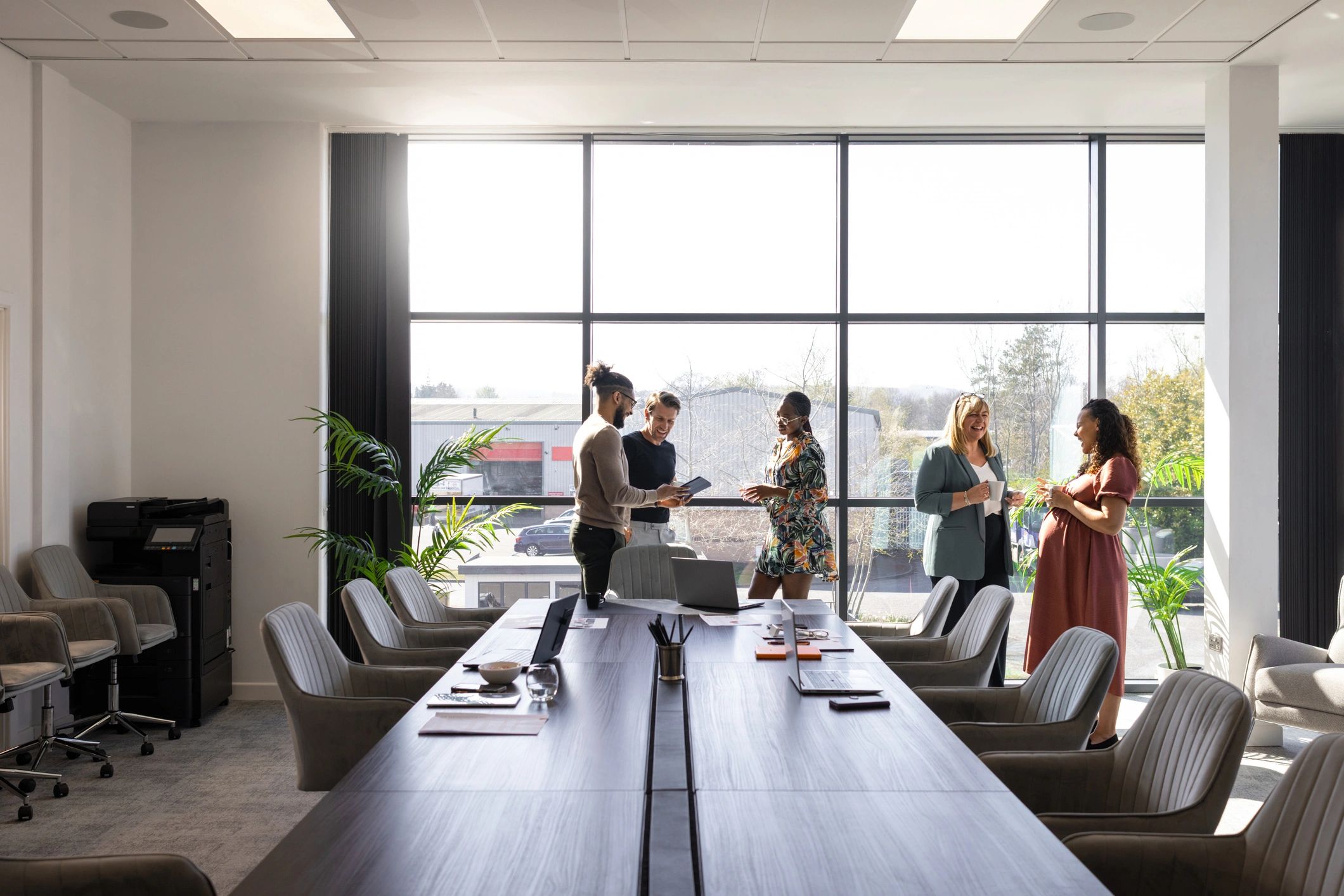 Team discussion in a bright editorial workspace