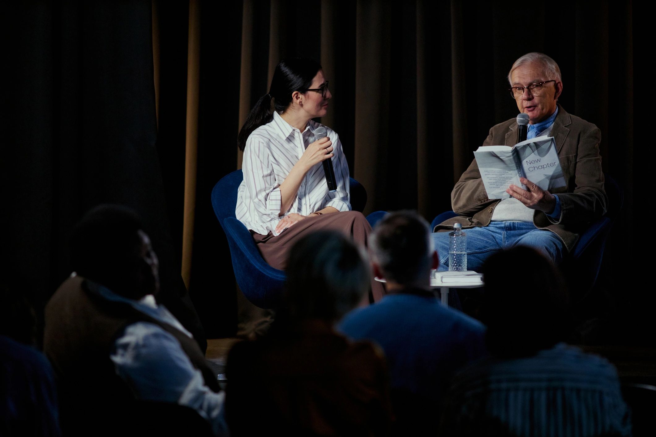 Stage discussion representing celebrity interviews and event buzz